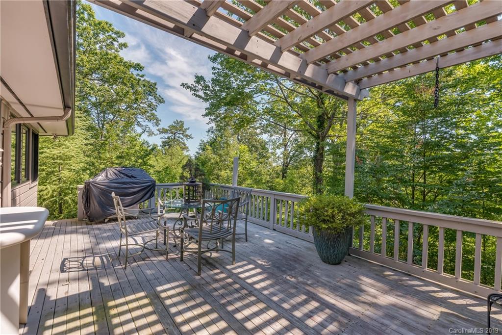 320 Ridgetop Road Tryon, NC 28782 - Photo 28 of 36 a view of a chair and table in backyard