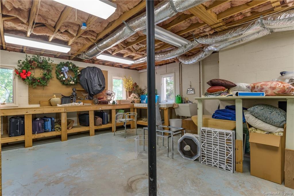 320 Ridgetop Road Tryon, NC 28782 - Photo 36 of 36 a view of living room with clothes and a garage