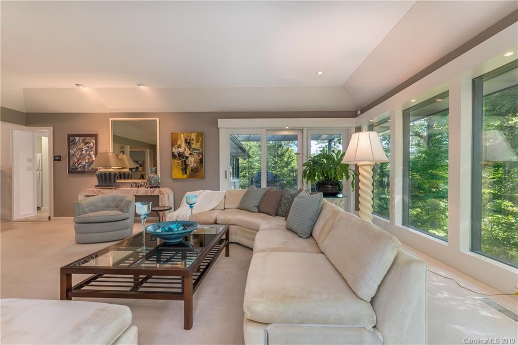 320 Ridgetop Road Tryon, NC 28782 - Photo 7 of 36 a living room with furniture and a floor to ceiling window