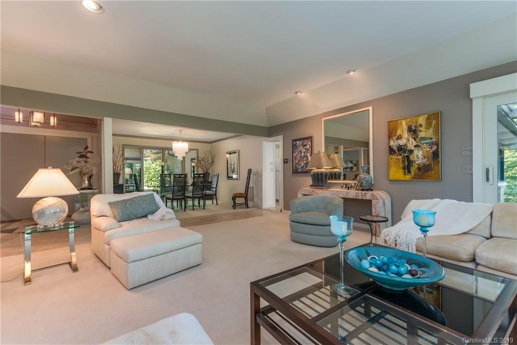 320 Ridgetop Road Tryon, NC 28782 - Photo 8 of 36 a living room with furniture and a chandelier