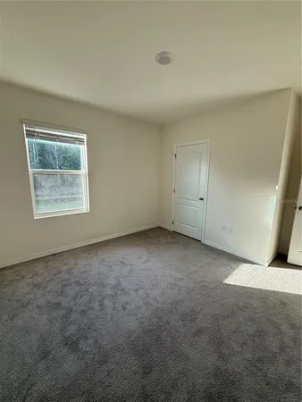 a bathroom with a granite countertop toilet a sink and a bathtub