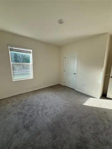 a bathroom with a granite countertop toilet a sink and a bathtub