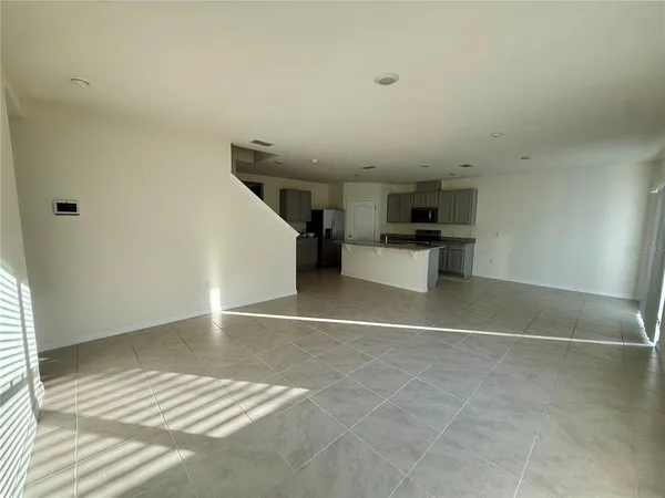 a view of a hallway to rooms