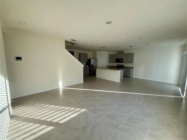 a view of a hallway to rooms