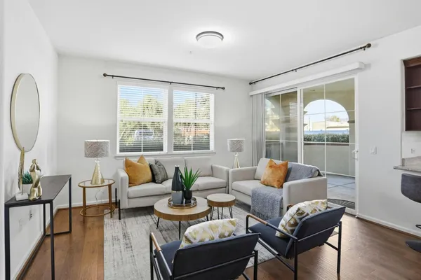 a living room with furniture and a large window