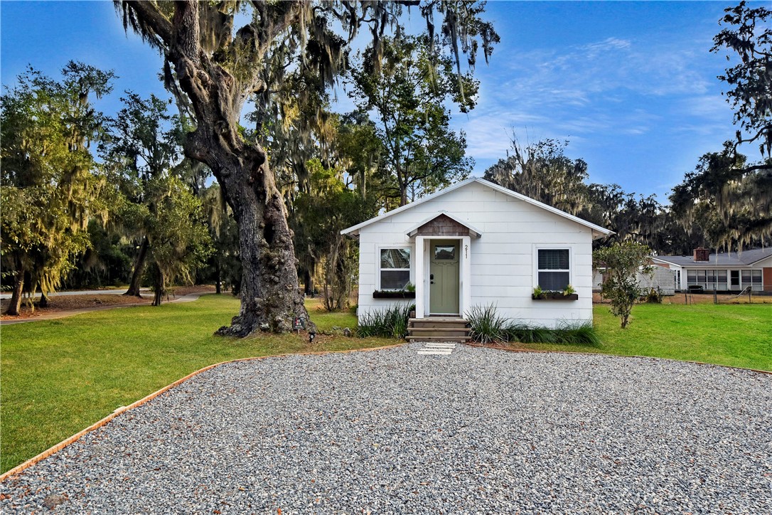 Ample parking on this easy to maintain gravel parking pad