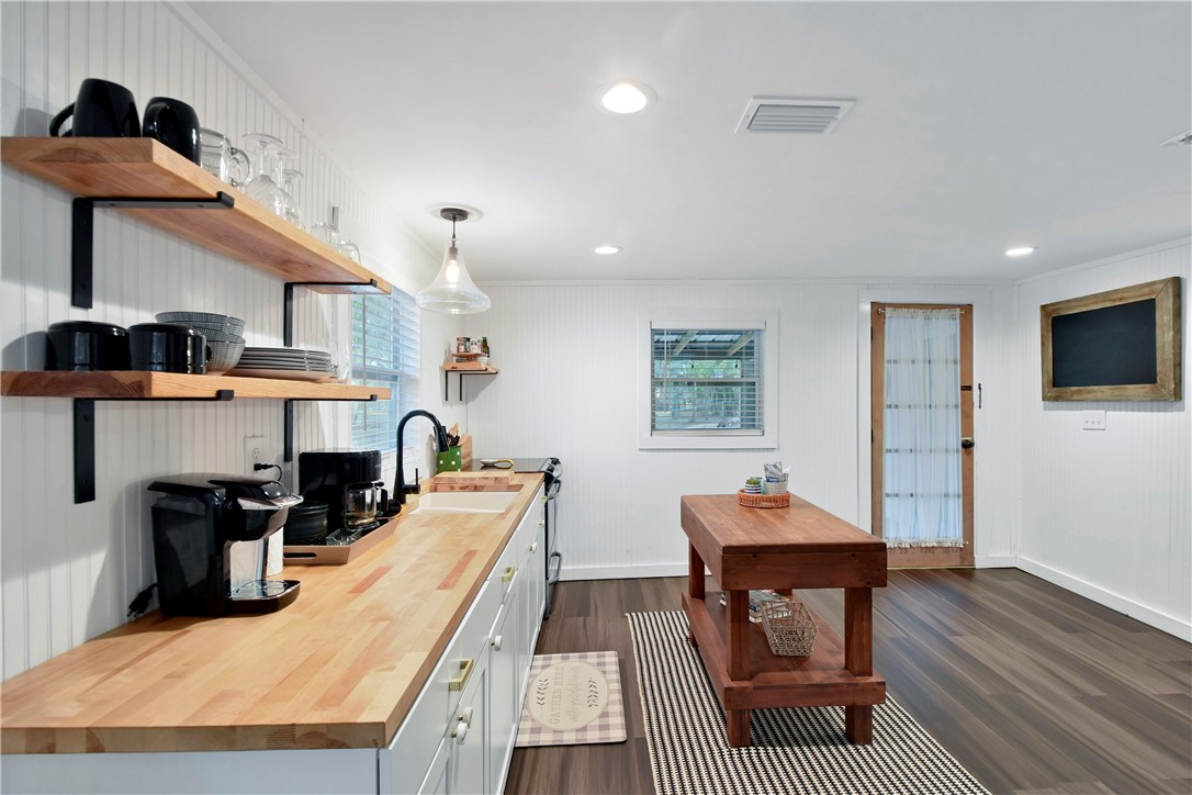 211 Trumbull Street Darien, GA 31305 - Photo 15 of 26 The kitchen is fresh, spacious and provides plenty of counter space and storage.