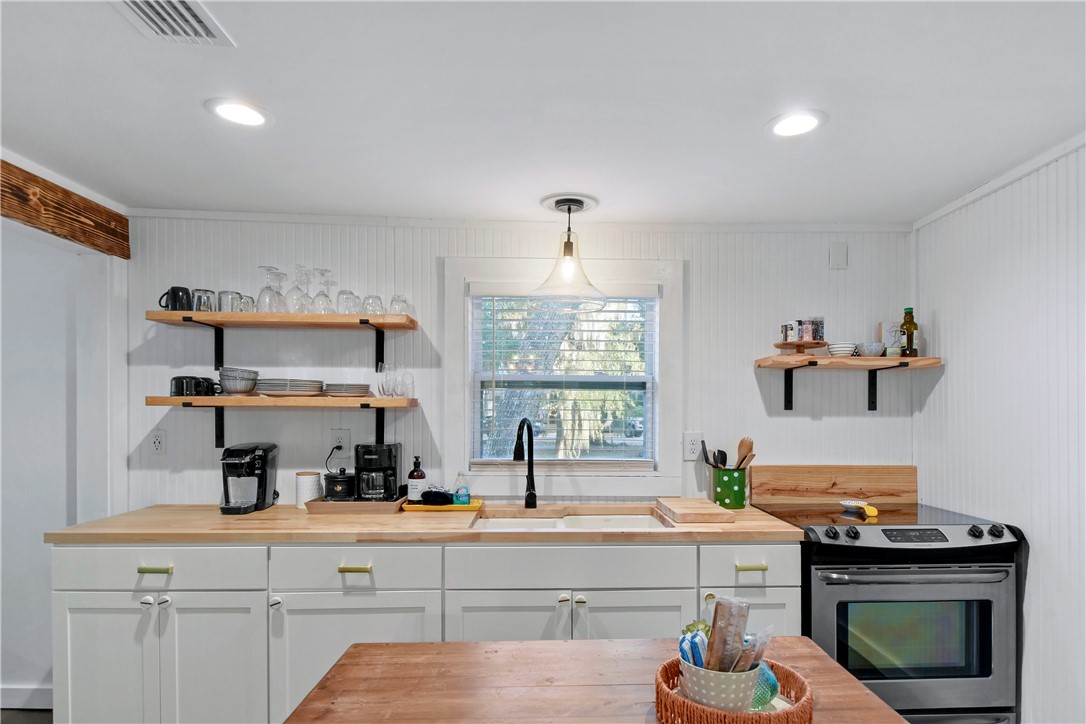 211 Trumbull Street Darien, GA 31305 - Photo 16 of 26 New butcher block, cabinetry, sink, hardware & appliances.