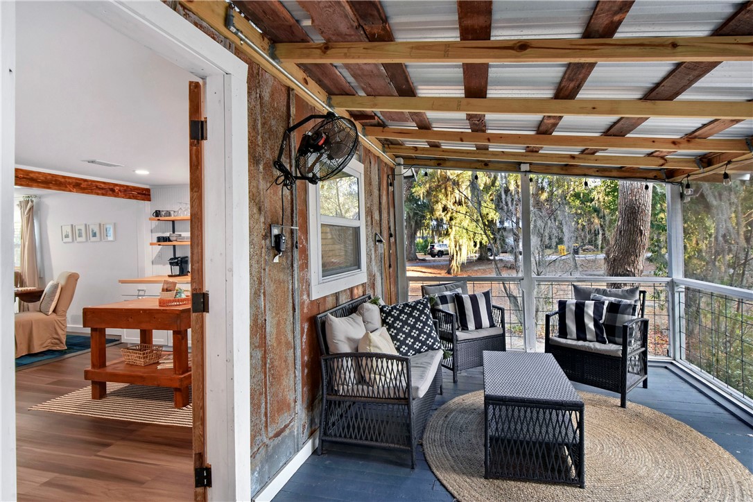 211 Trumbull Street Darien, GA 31305 - Photo 19 of 26 The screened porch is located off the kitchen, at the back of the house.