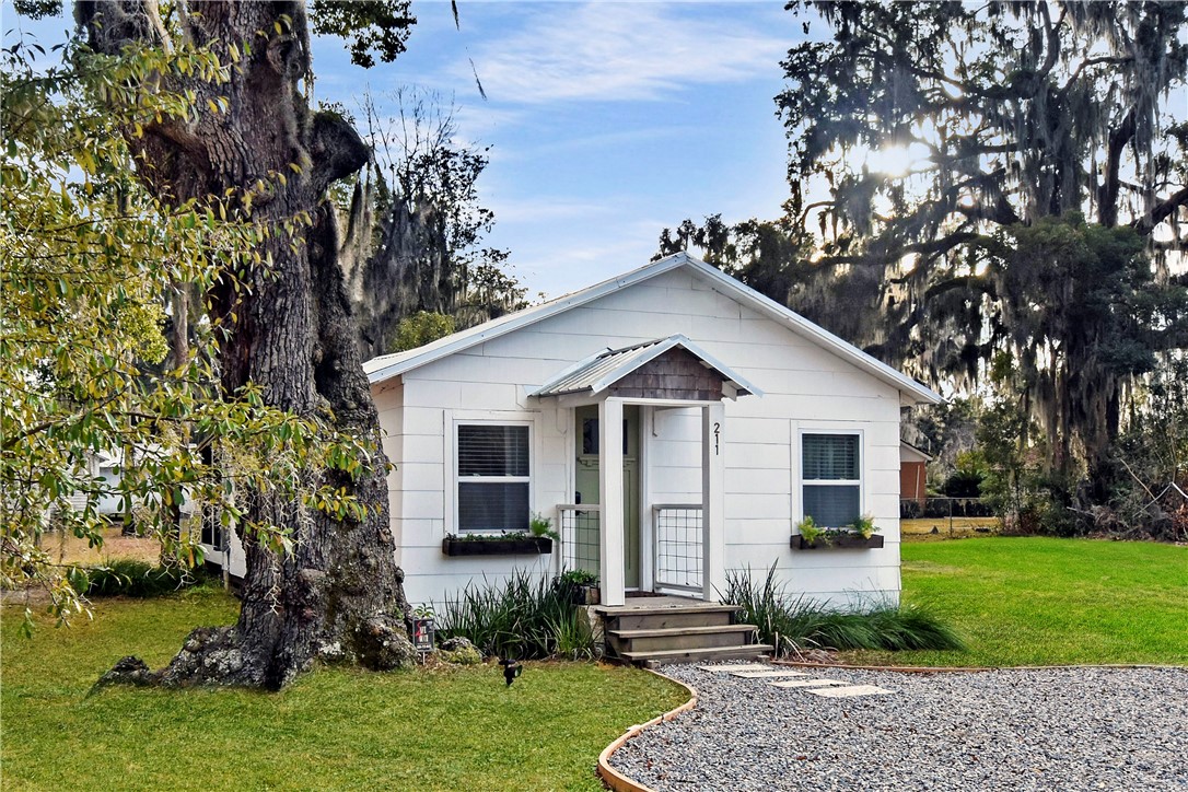 211 Trumbull Street Darien, GA 31305 - Photo 2 of 26 Historic Charm prevails among new siding, windows & front door.
