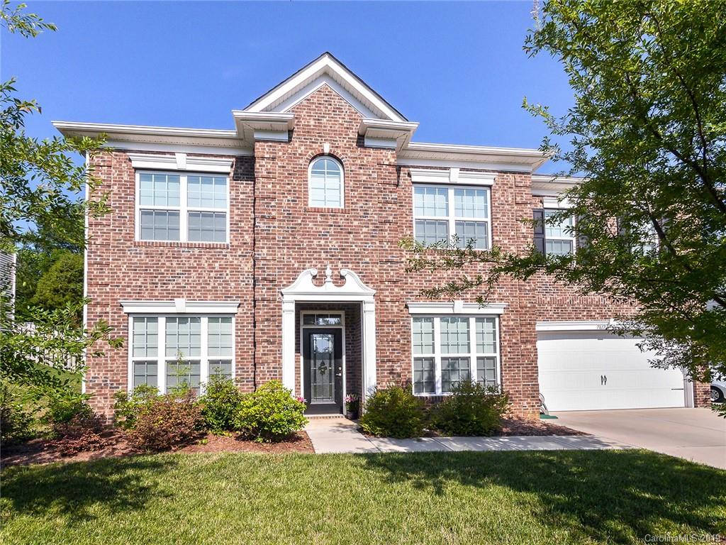 7817 Pope Farm Road Charlotte, NC 28269 - Photo 1 of 26 a front view of a house with garden