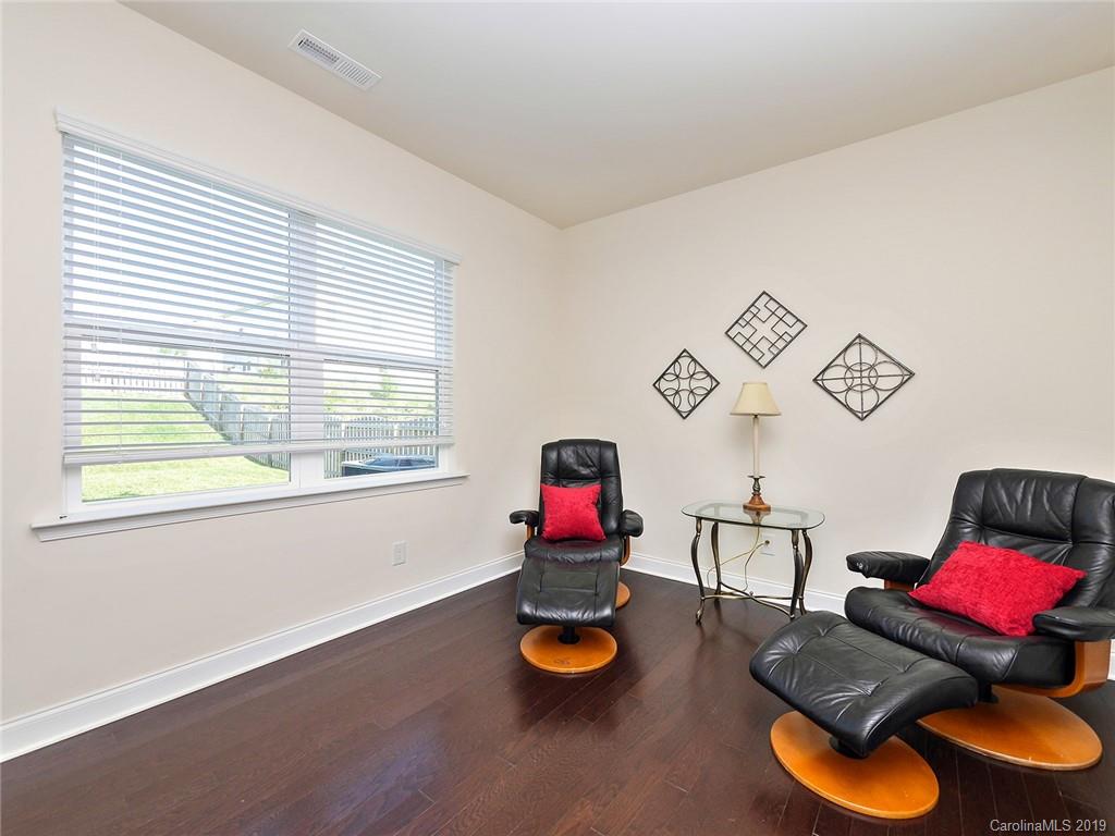 7817 Pope Farm Road Charlotte, NC 28269 - Photo 12 of 26 a living room with furniture and a window