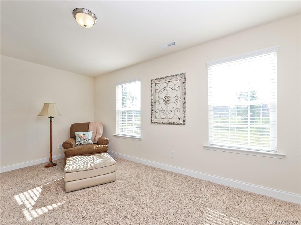 7817 Pope Farm Road Charlotte, NC 28269 - Photo 19 of 26 a living room with furniture and a window