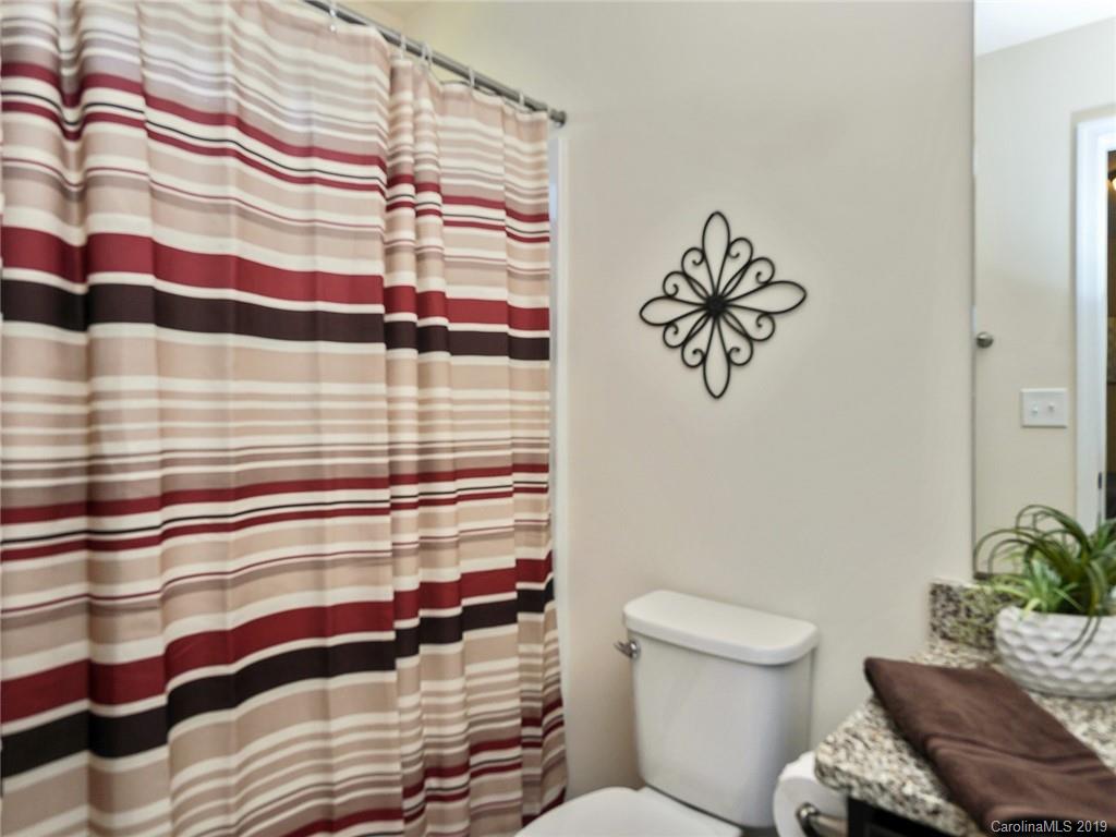 7817 Pope Farm Road Charlotte, NC 28269 - Photo 20 of 26 a bathroom with a sink and a toilet