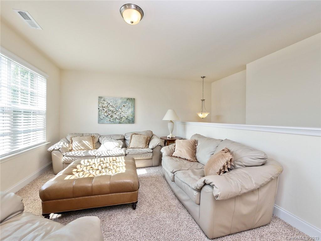 7817 Pope Farm Road Charlotte, NC 28269 - Photo 21 of 26 a living room with furniture