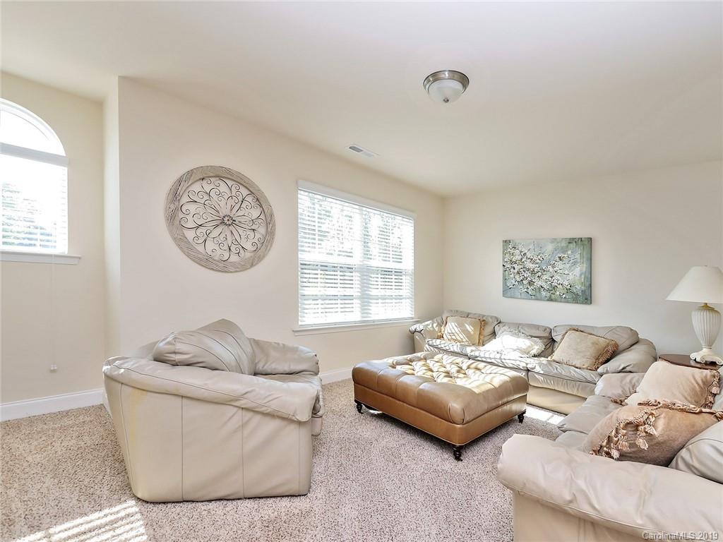 7817 Pope Farm Road Charlotte, NC 28269 - Photo 22 of 26 a living room with furniture and a window