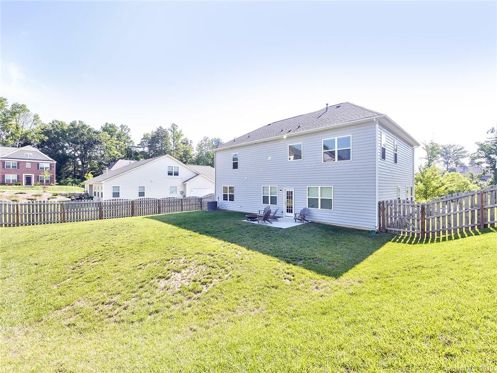 7817 Pope Farm Road Charlotte, NC 28269 - Photo 23 of 26 a view of a house with a yard and sitting area