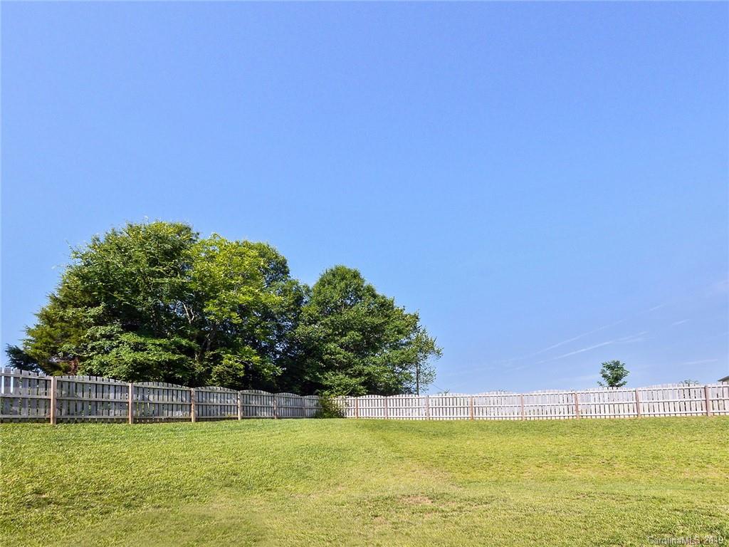 7817 Pope Farm Road Charlotte, NC 28269 - Photo 24 of 26 a view of a swimming pool with an outdoor space and seating area
