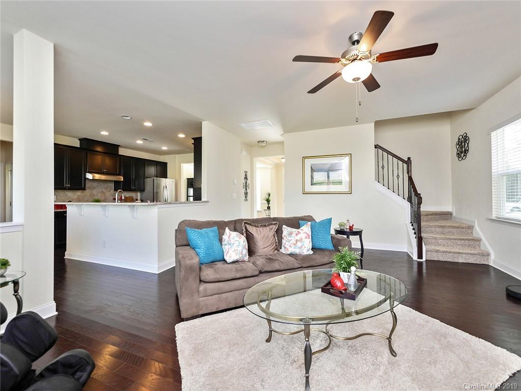 7817 Pope Farm Road Charlotte, NC 28269 - Photo 5 of 26 a living room with furniture and kitchen view