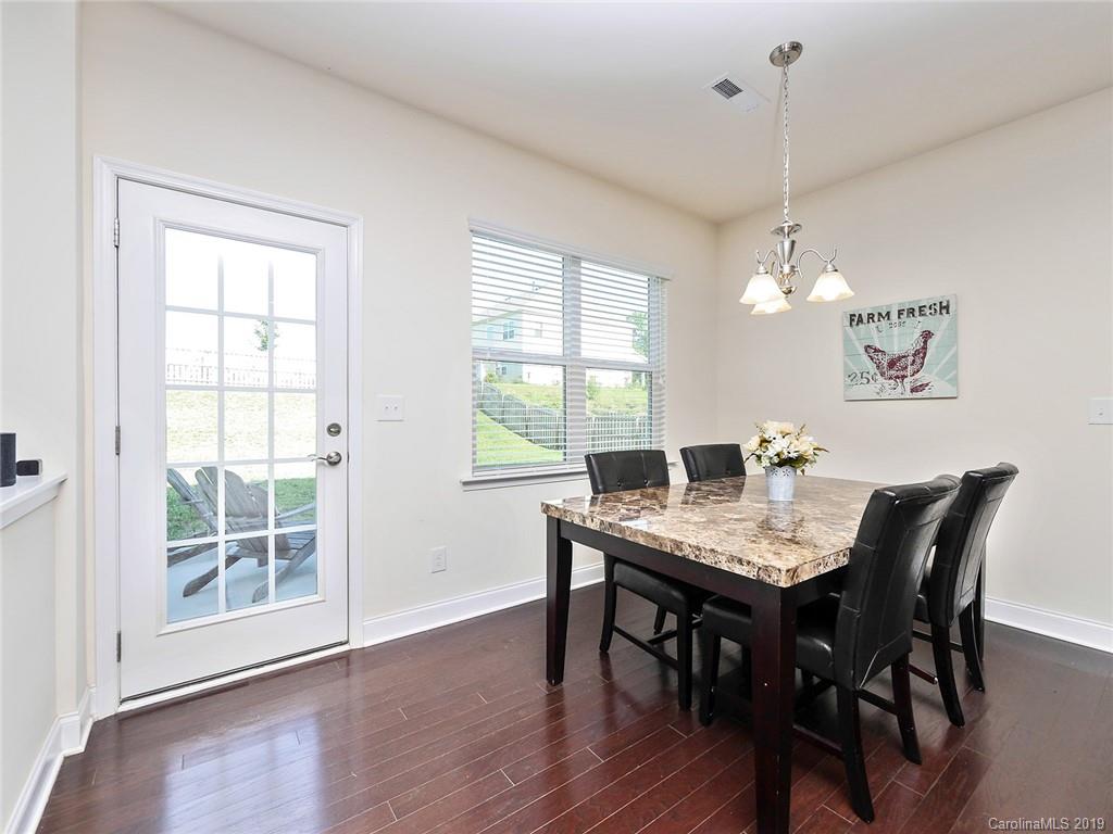7817 Pope Farm Road Charlotte, NC 28269 - Photo 8 of 26 a view of a dining room with a table and chairs