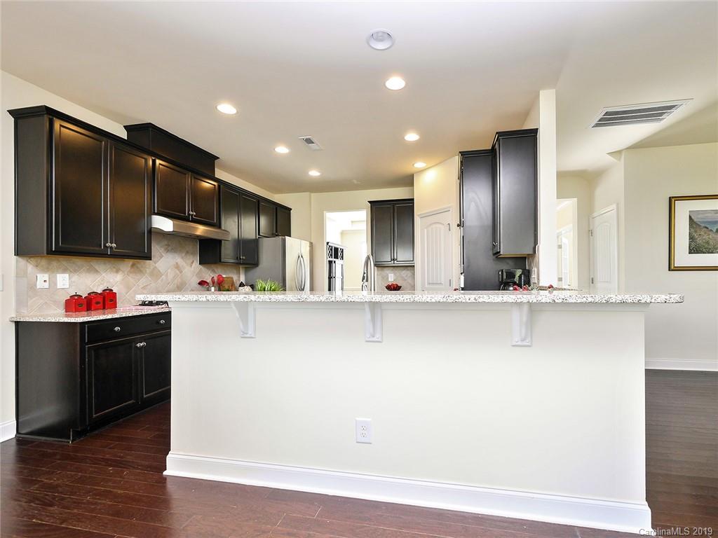 7817 Pope Farm Road Charlotte, NC 28269 - Photo 9 of 26 a view of kitchen with stainless steel appliances cabinets