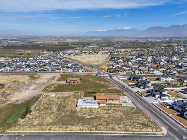 296 West Olympic Lane, Unit 2 Elk Ridge, UT 84651 - Photo 9 of 14 View of property location featuring nearby suburban area and a mountain backdrop