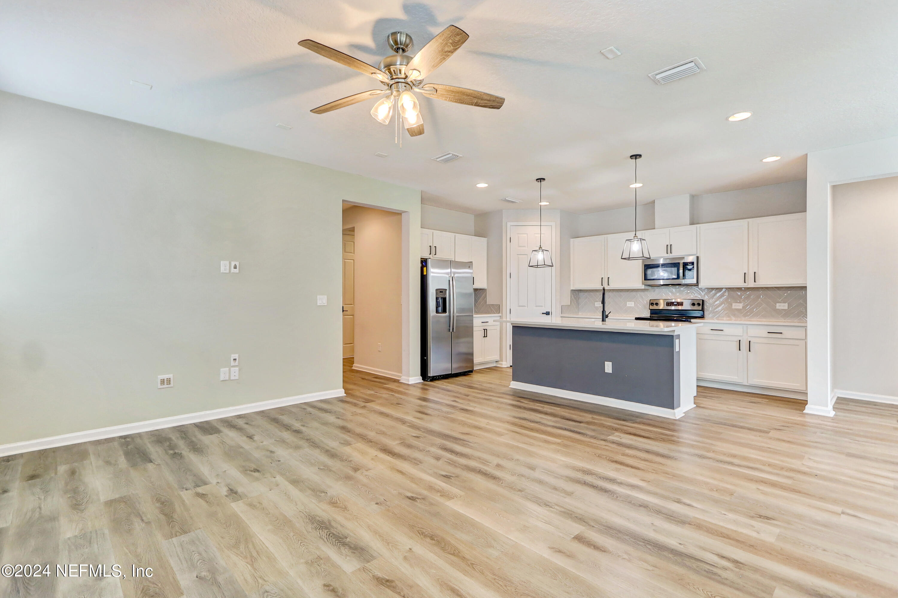 1880 Cogdill Trace Middleburg, FL 32068 - Photo 18 of 40 a view of kitchen with wooden floor and window