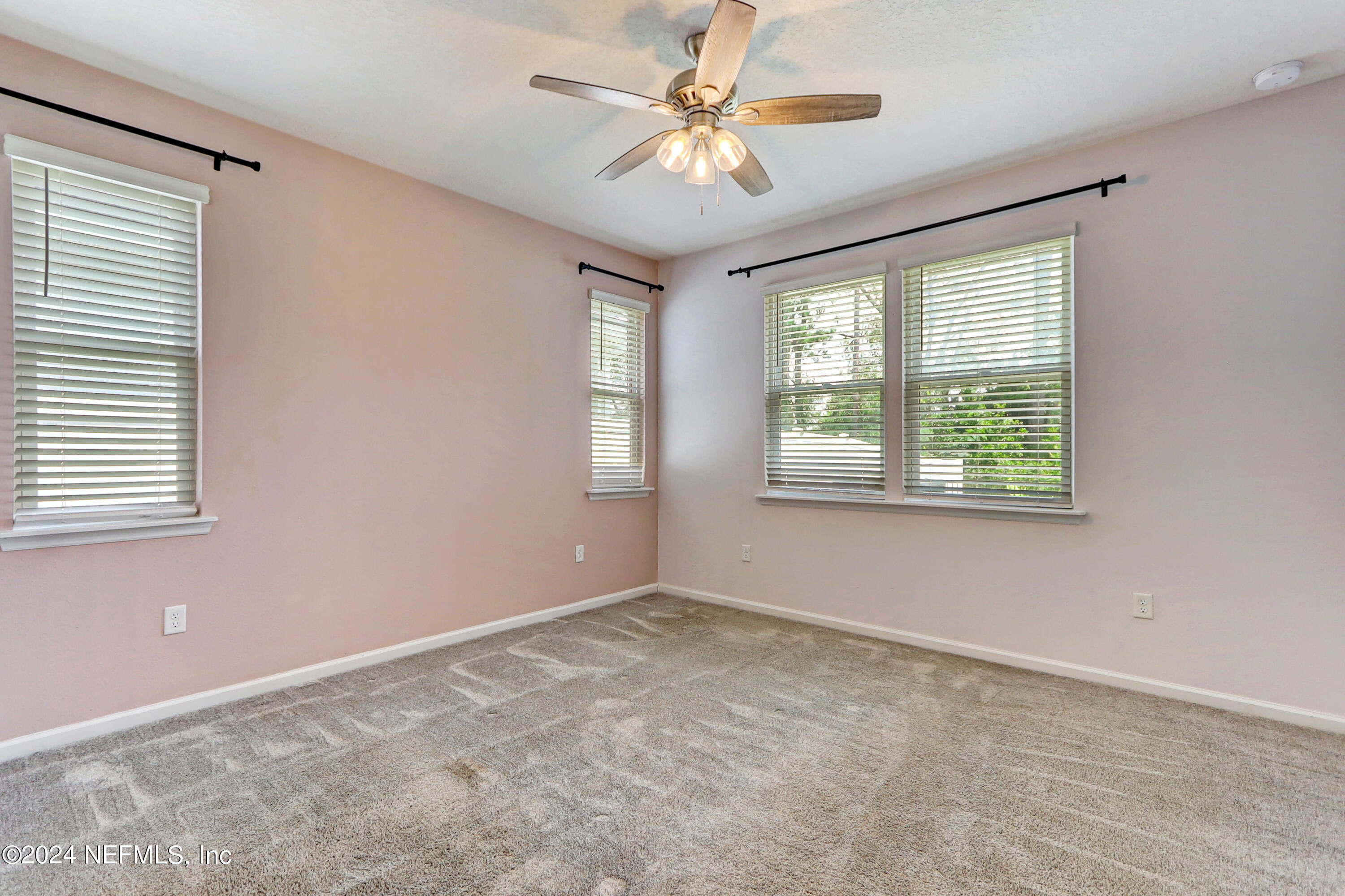 1880 Cogdill Trace Middleburg, FL 32068 - Photo 22 of 40 wooden floor in an empty room with a window