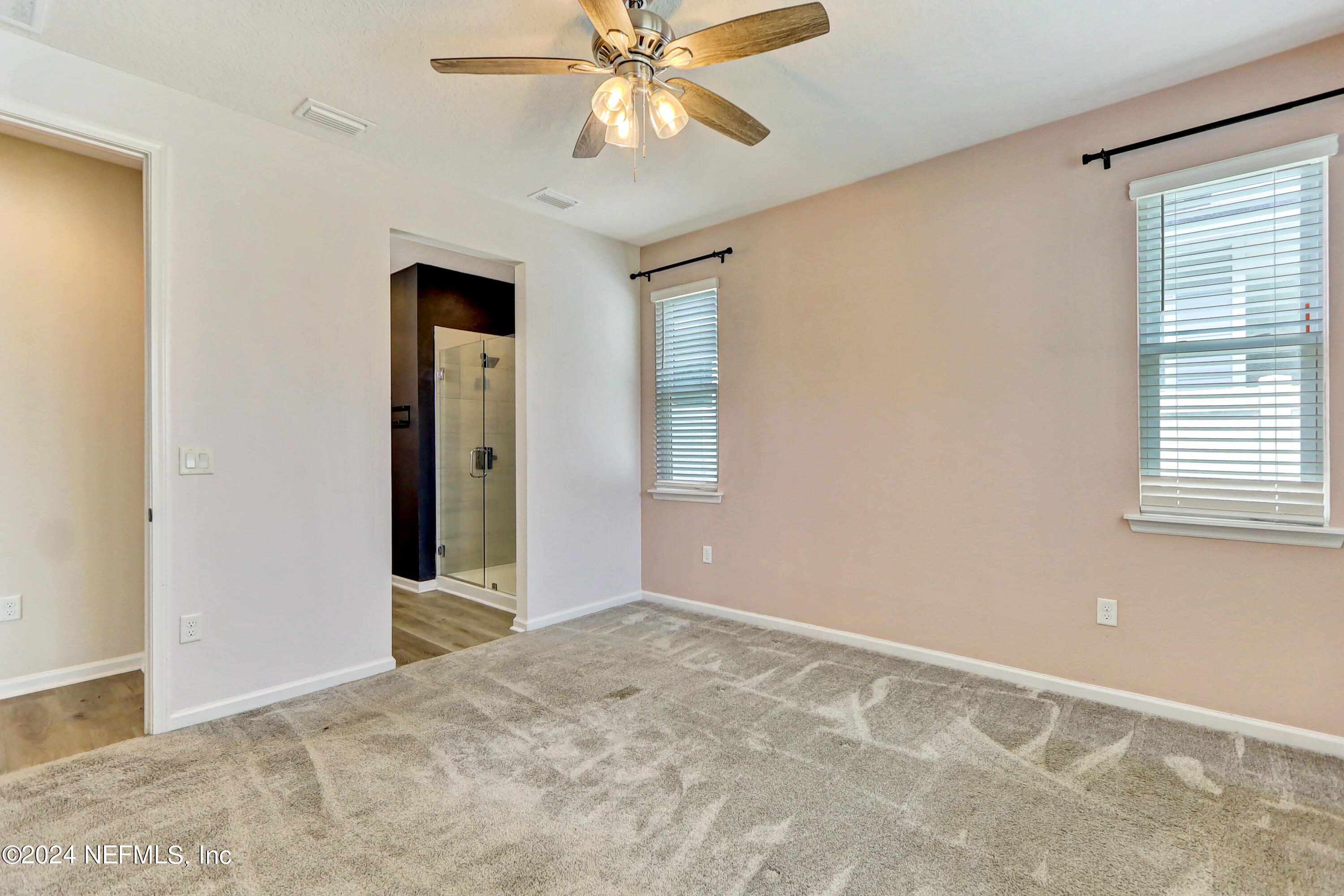 1880 Cogdill Trace Middleburg, FL 32068 - Photo 23 of 40 an empty room with closet and a chandelier fan