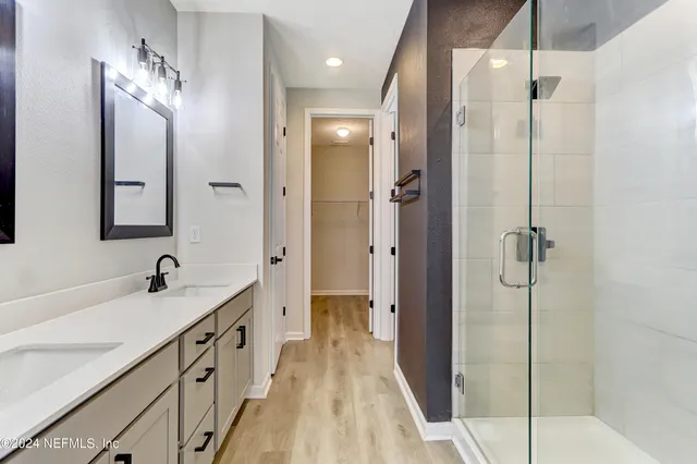 a bathroom with a sink and mirror
