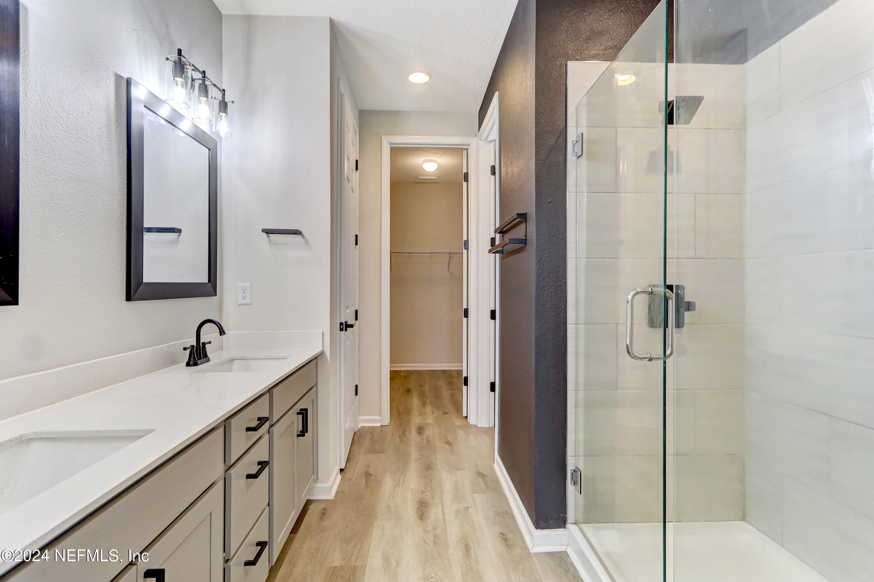 1880 Cogdill Trace Middleburg, FL 32068 - Photo 25 of 40 a bathroom with a sink and mirror