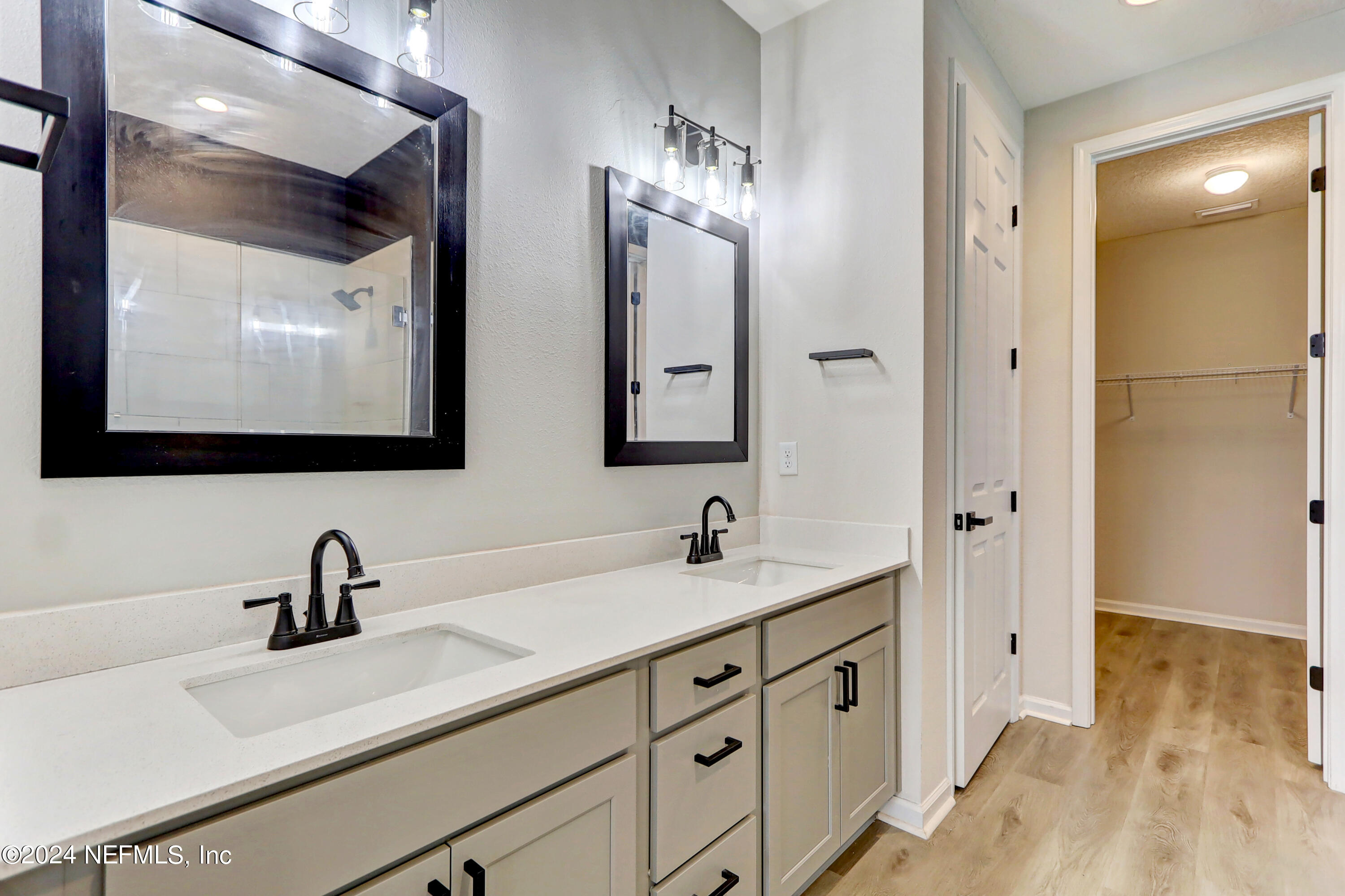 1880 Cogdill Trace Middleburg, FL 32068 - Photo 26 of 40 a bathroom with double sink and three mirror