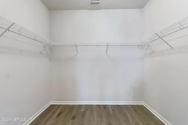 a view of a room with racks on the wall