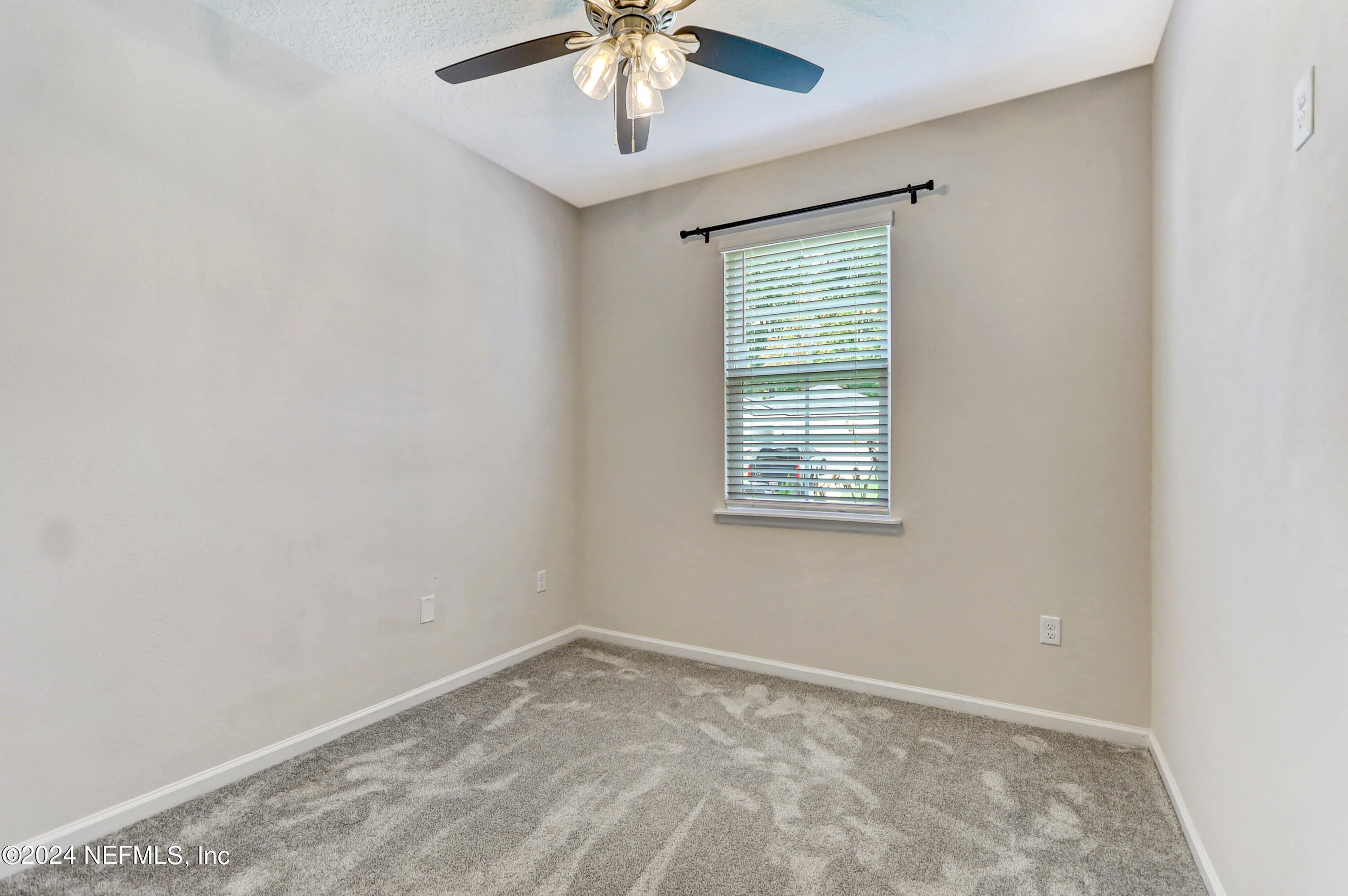 1880 Cogdill Trace Middleburg, FL 32068 - Photo 29 of 40 an empty room with a window and a fan