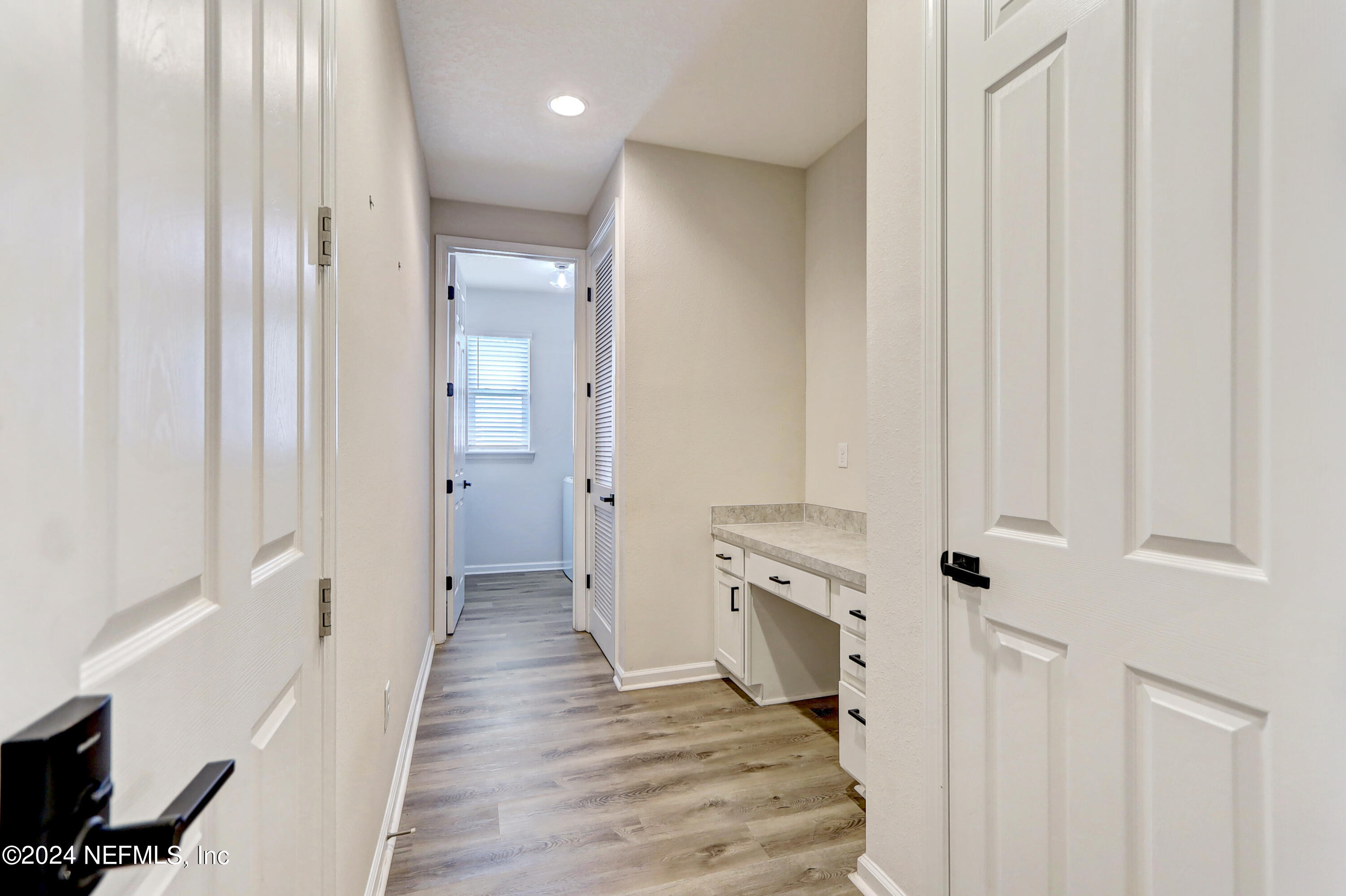 1880 Cogdill Trace Middleburg, FL 32068 - Photo 35 of 40 a view of a hallway with wooden floor and staircase