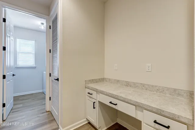 an empty room with wooden floor