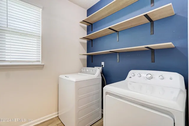 a utility room with dryer and washer
