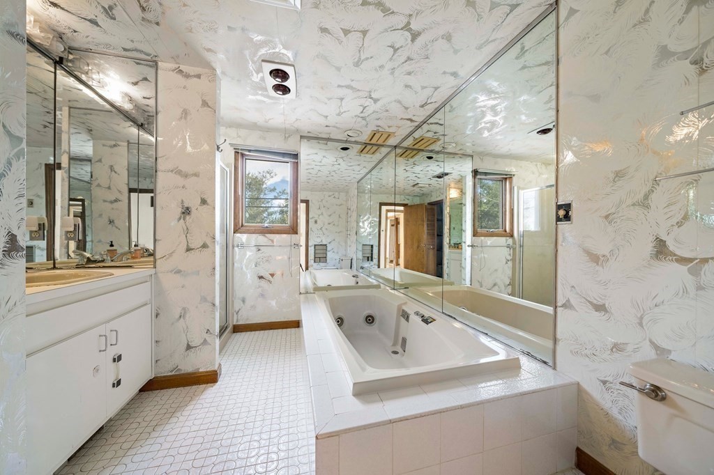 212 Nantasket Road Hull, MA 02045 - Photo 22 of 36 a bathroom with a tub sink shower and mirror