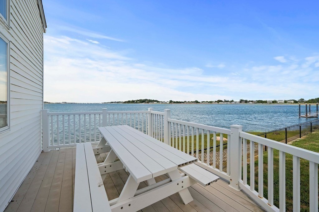 212 Nantasket Road Hull, MA 02045 - Photo 25 of 36 a view of a balcony with wooden floor and city view