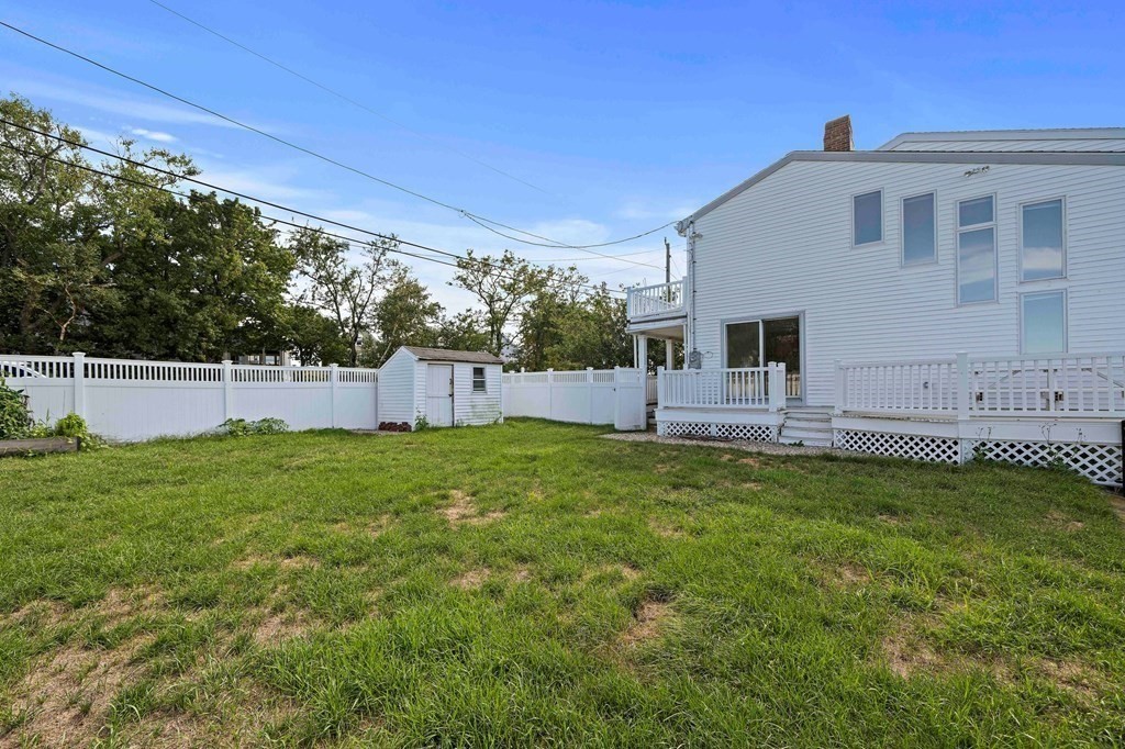 212 Nantasket Road Hull, MA 02045 - Photo 34 of 36 a backyard of a house with table and chairs