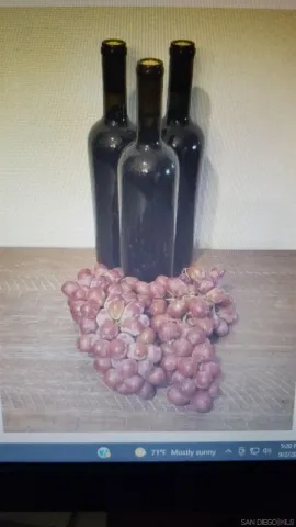 a bathroom with a granite countertop sink a mirror and bathtub
