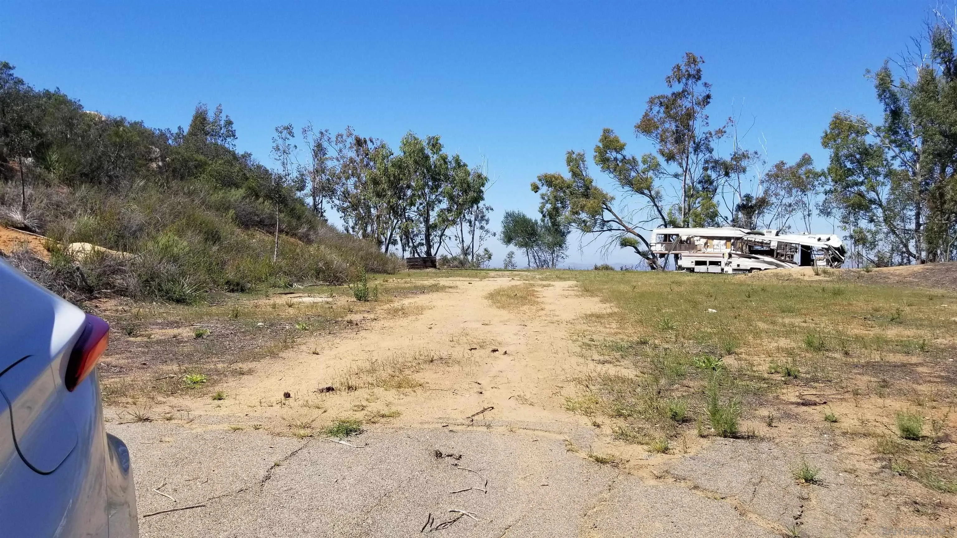 12526 Southwest Boulder Mt Road, Unit 1 2 3 Poway, CA 92064 - Photo 2 of 16 a view of a yard with swimming pool and trees