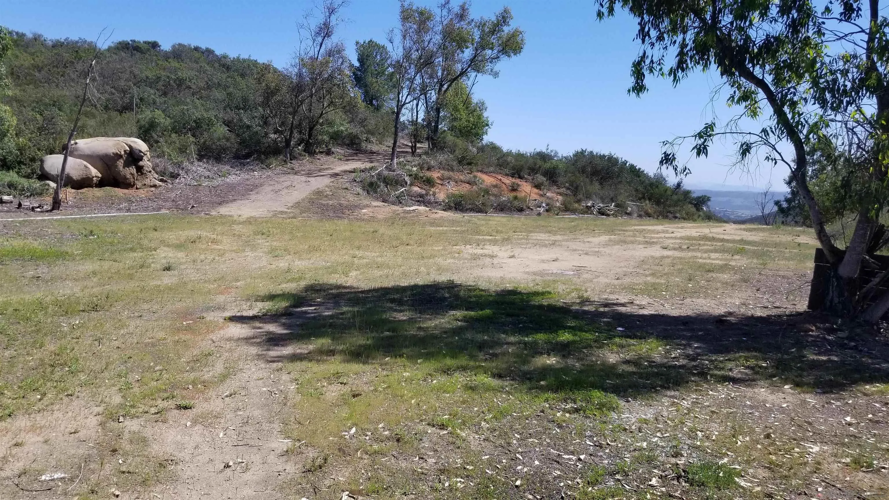 12526 Southwest Boulder Mt Road, Unit 1 2 3 Poway, CA 92064 - Photo 3 of 16 a view of a backyard with green space