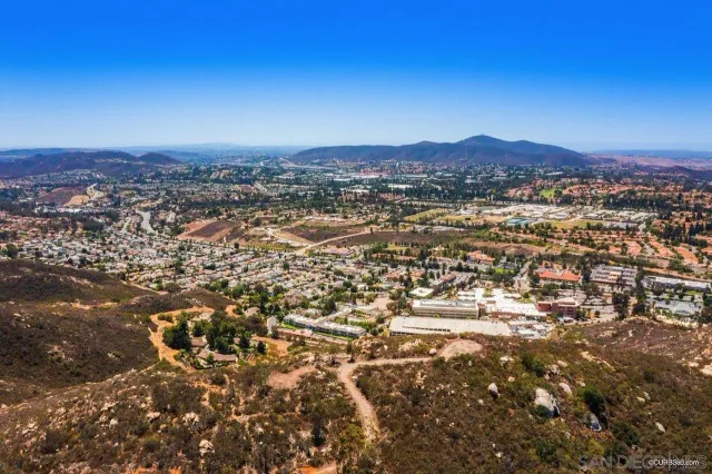an aerial view of residential house and car parked
