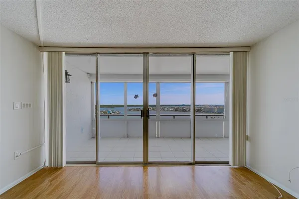 a view of a room with wooden floor