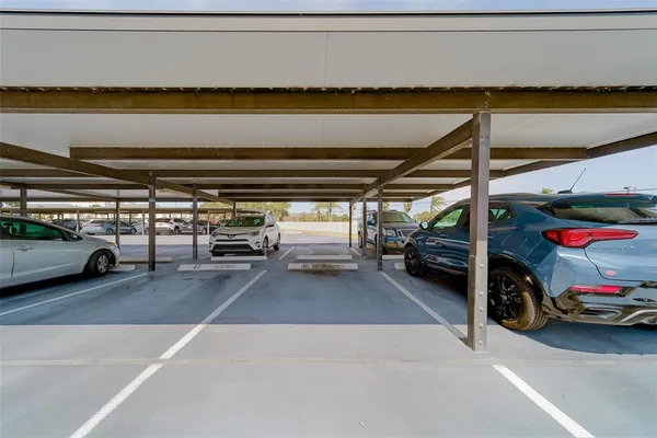 a view of parking garage with cars