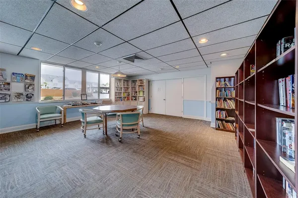 a kitchen with granite countertop cabinets and refrigerator
