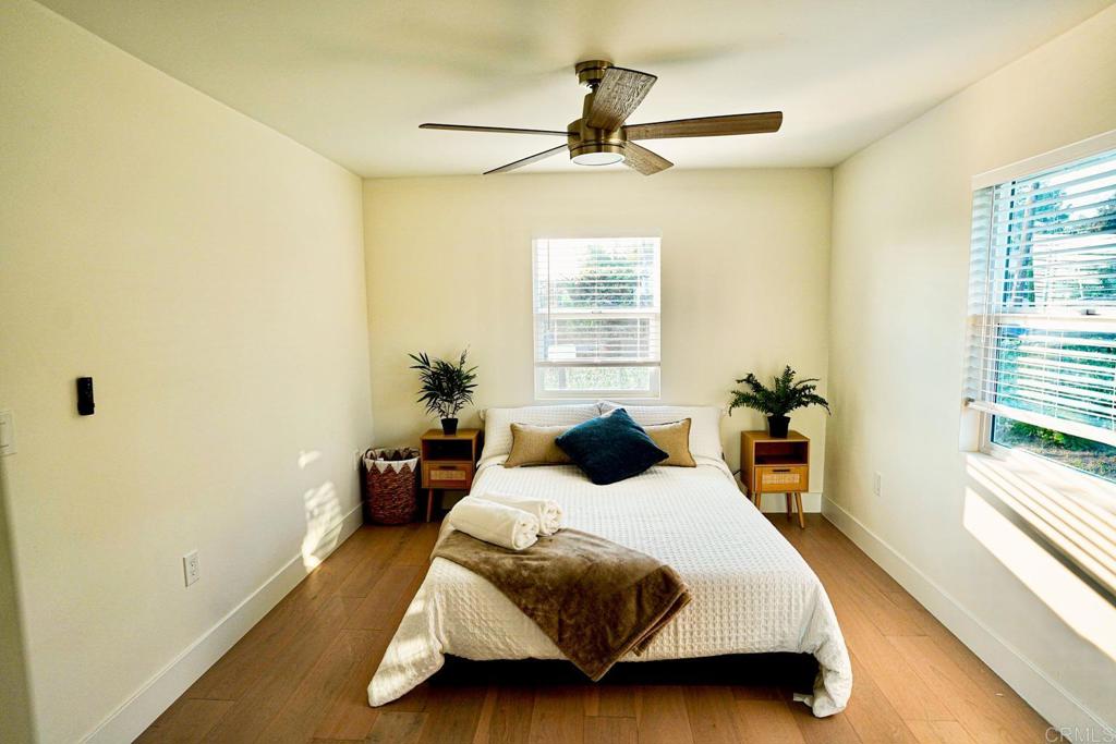 2687 Littleton Road El Cajon, CA 92020 - Photo 17 of 24 a bedroom with a bed and wooden floor