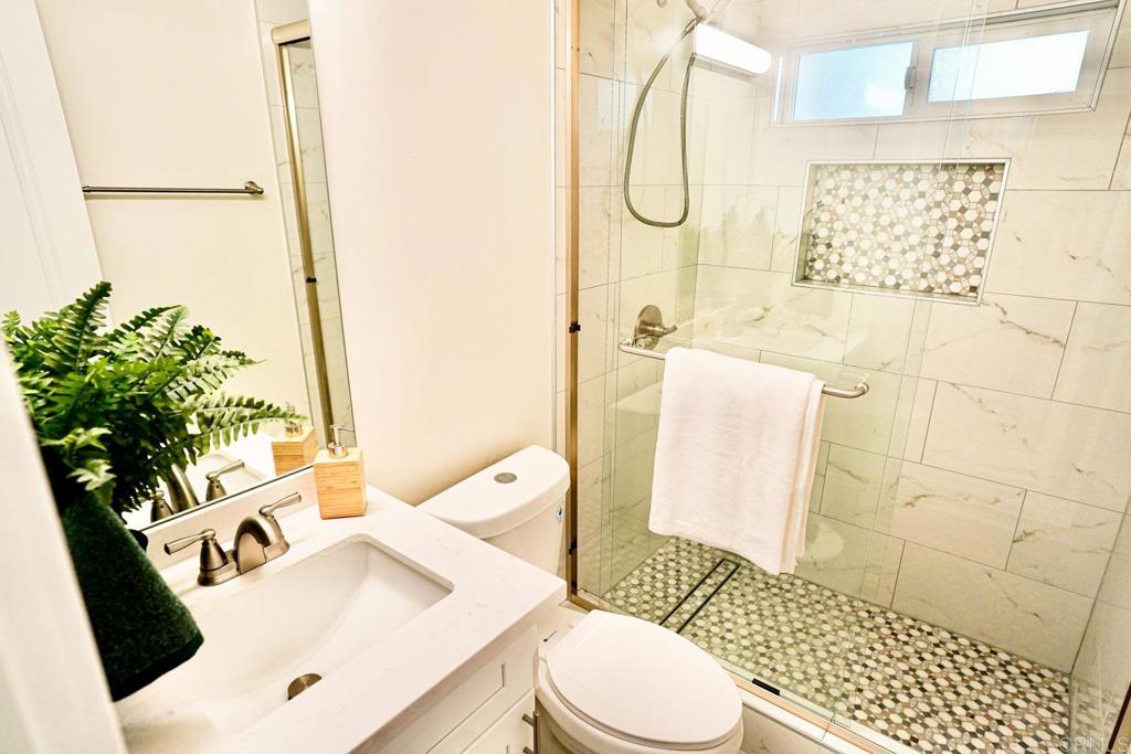 2687 Littleton Road El Cajon, CA 92020 - Photo 18 of 24 a bathroom with a sink toilet and shower