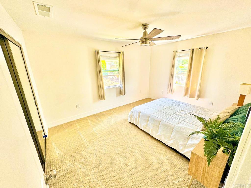 2687 Littleton Road El Cajon, CA 92020 - Photo 19 of 24 a bedroom with a bed and a window